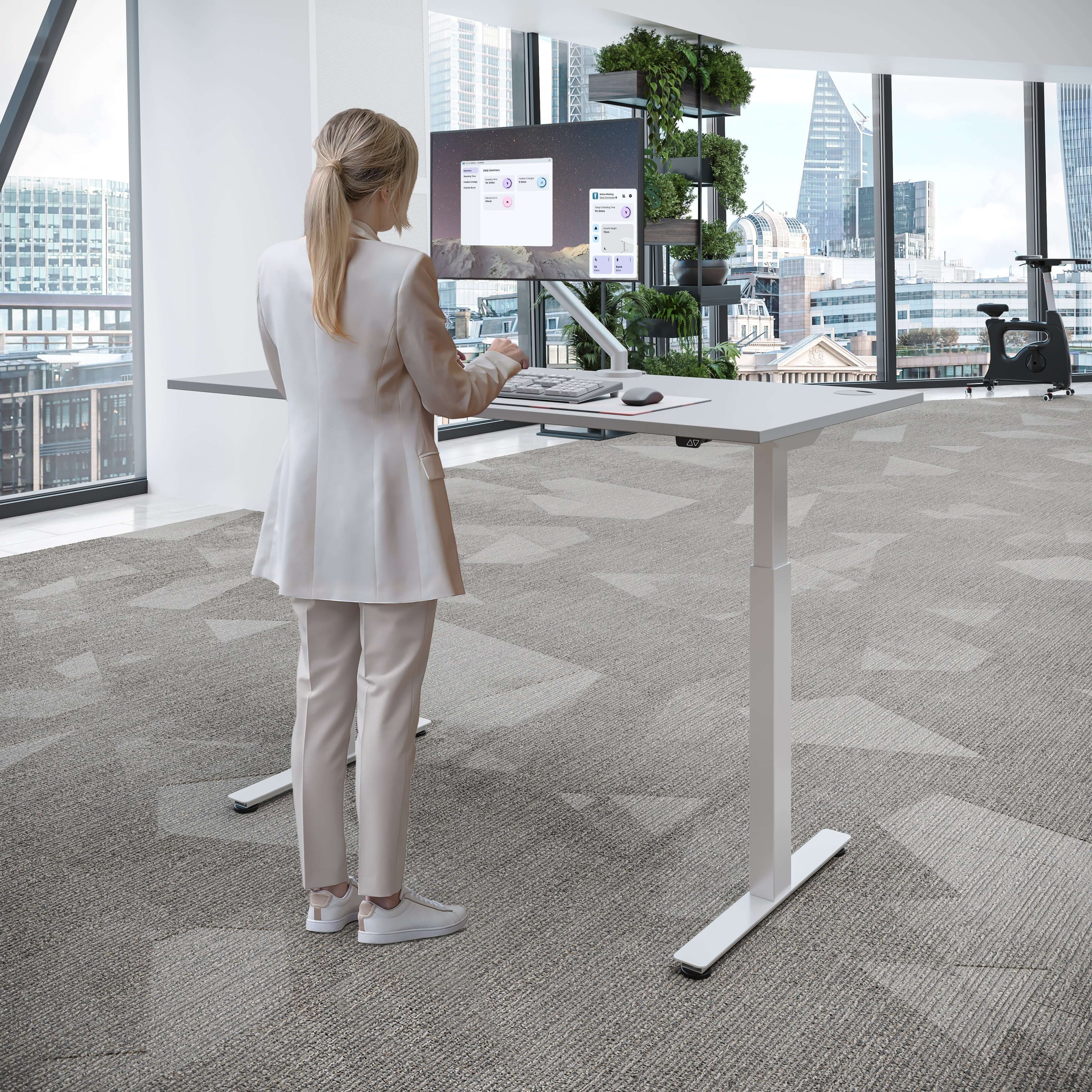 iLohas Active 2 standing desk in a modern workspace, featuring a user working comfortably at the adjustable height desk.
